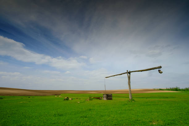 Shadoof on the pasture landscape Shadoof on the pasture landscape thomas wells stock pictures, royalty-free photos & images