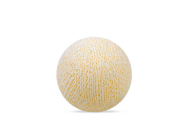 Light yellow pastel cotton ball on pure white background.