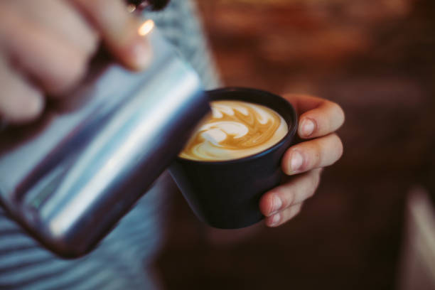 istock Barista Pouring Latte Art 688454238