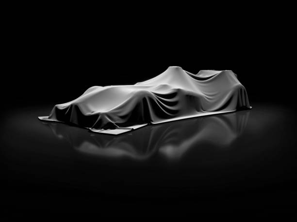 istock open-wheel single-seater racing car car launch in clean empty dark studio, open-wheel single-seater racing car car covered with fabric pre launch 688457906