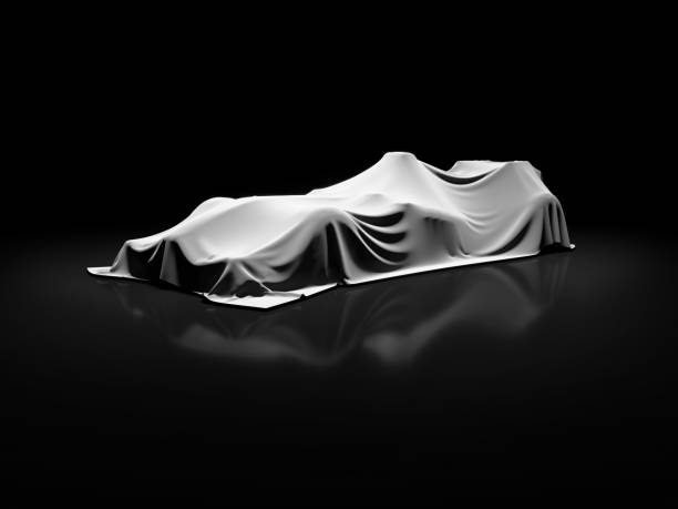 istock open-wheel single-seater racing car car launch in clean empty dark studio, open-wheel single-seater racing car car covered with fabric pre launch 688457910