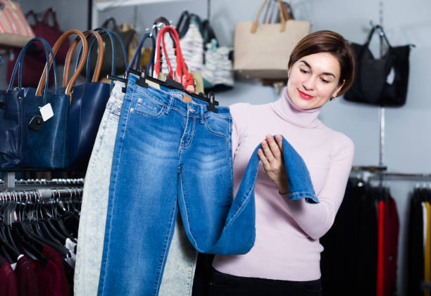 istock Customer is choosing new jeans 688461524