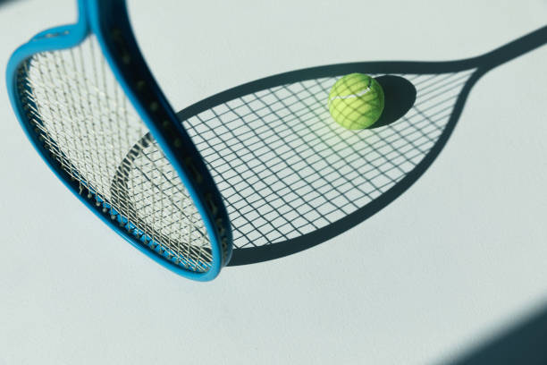 istock tennis racket and ball on the floor 688461884