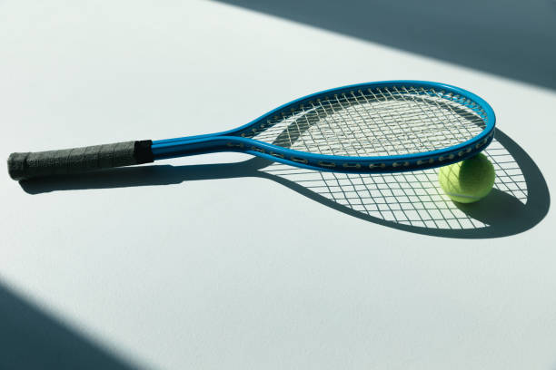 istock tennis racket and ball on the floor 688464572
