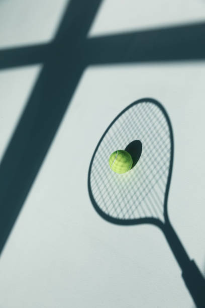 istock tennis racket and ball on the floor 688465248