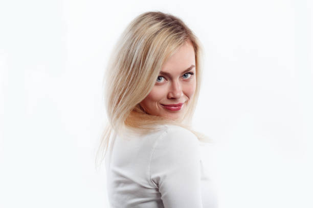 istock Beautiful woman smiling face close up studio on white. 688468048