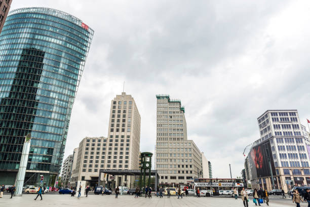 potsdamer platz in berlin, germany - clock station people berlin germany imagens e fotografias de stock