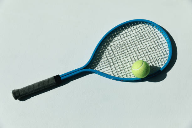 istock tennis racket and ball on the floor 688468680