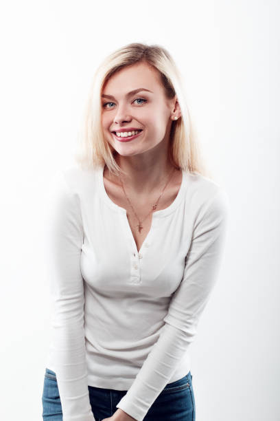 istock Beautiful woman smiling face close up studio on white. 688468934