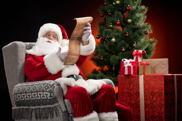 istock Santa Claus reading wishlist 688471256
