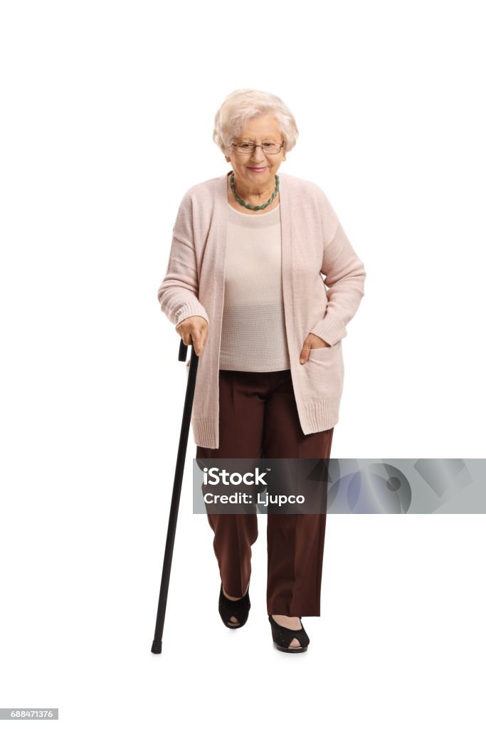 Femme mûr avec une marche de canne - Photo de Cadrage en pied libre de droits