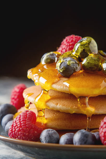 istock Stack of pancakes with fresh blueberry and maple syrup 688471630