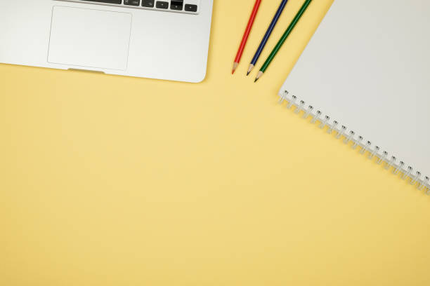 istock Minimal workplace with notebook and copy space on pastel background. Top view. Flat lay. 688476404