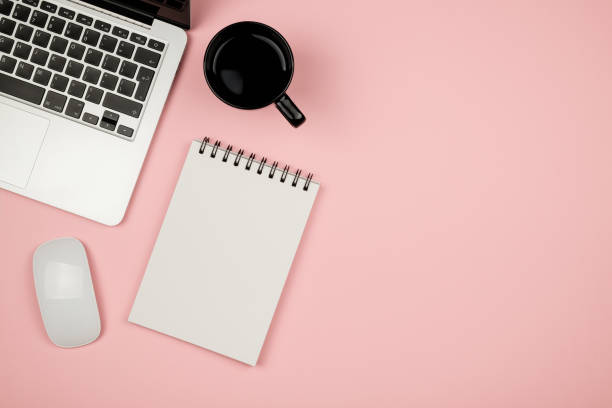 istock Minimal workplace with notebook and copy space on pastel background. Top view. Flat lay. 688476430