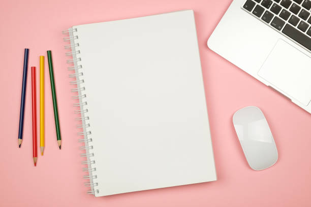 istock Top view flat lay picture with blank notepad page and different accessories on colored surface 688476432
