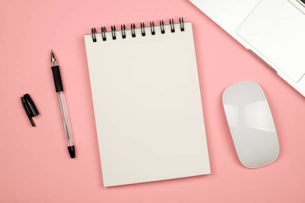 istock Top view flat lay picture with blank notepad page and different accessories on colored surface 688476454