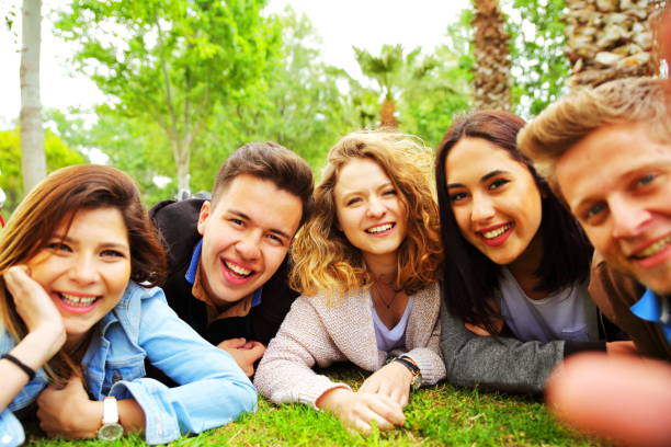 istock happy friends taking selfie 688479012