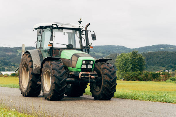 istock Tractor on countryside road 688479192