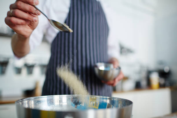 istock Putting salt in bowl 688479298