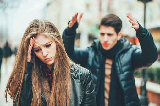 angry man shouting at his girlfriend