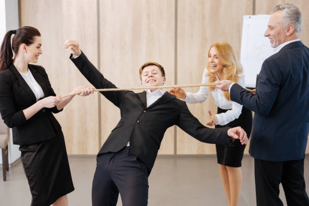 istock Delighted positive people holding the rope 688485262