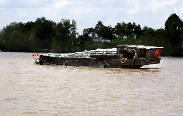 The front of a wooden boat  with a rope