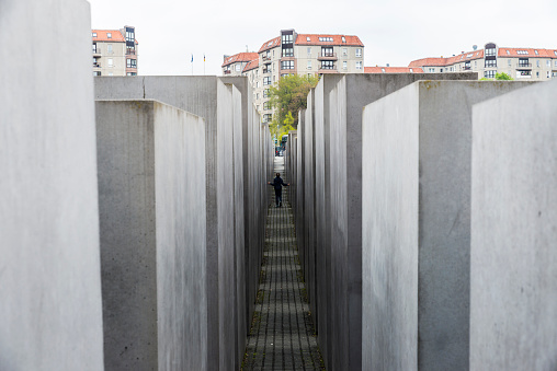 Berlin: Girl walking in the Memorial to the Murdered Jews of Europe, also known as the Holocaust Memorial (German: Holocaust-Mahnmal), is a memorial to the Jewish victims of the Holocaust in Berlin, Germany