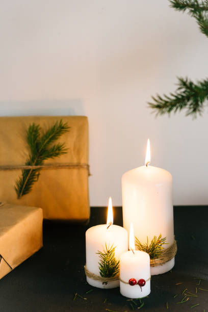 istock Christmas decorations with lit candles and gift boxes 688491152