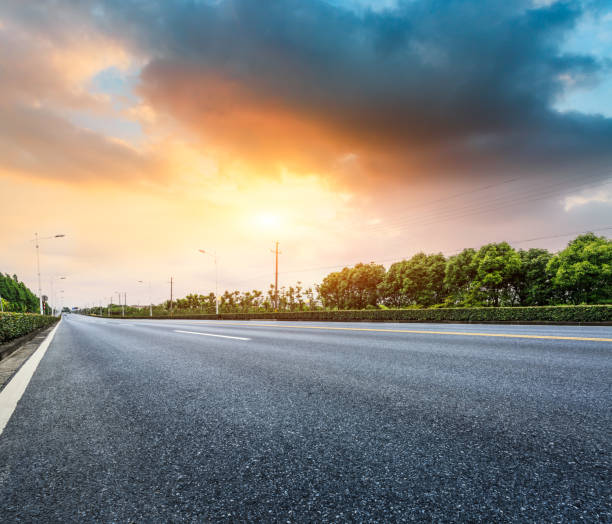 istock Country asphalt road at sunset 688499434