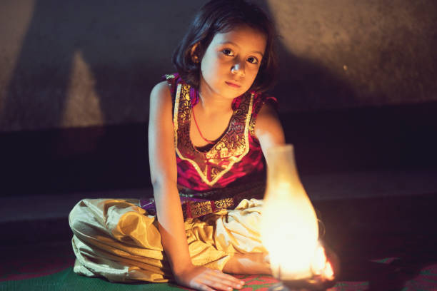 istock Girl holding oil lamp 688502886