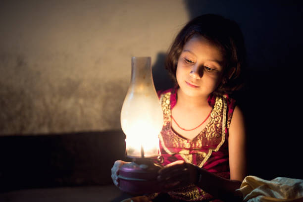 istock Girl holding oil lamp 688502920
