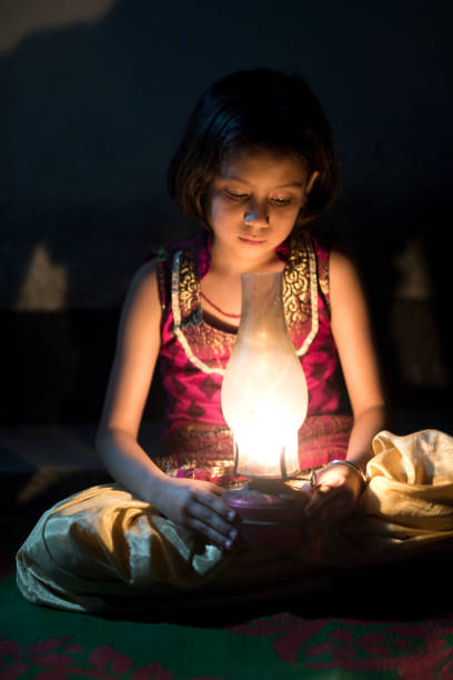 istock Girl holding oil lamp 688502984