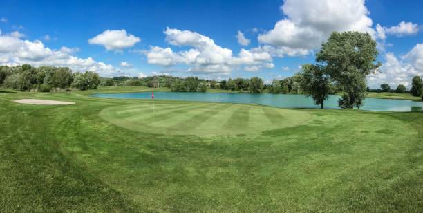 istock italian beautiful golf course, a lake and a blue sky 688506938