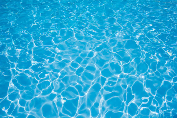 istock Beautiful blue water sur face in swimming pool 688511758