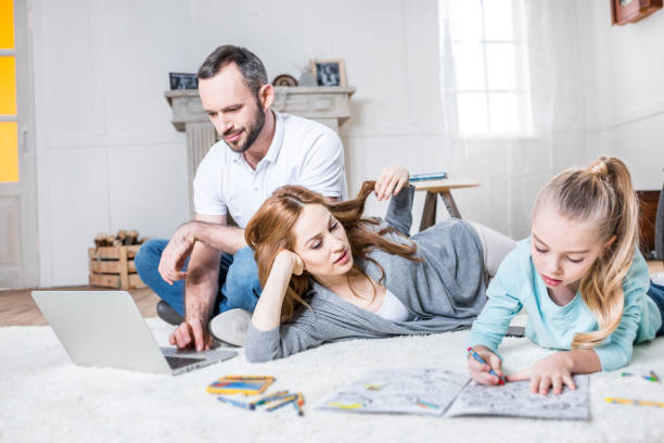 istock Family relaxing at home 688512258