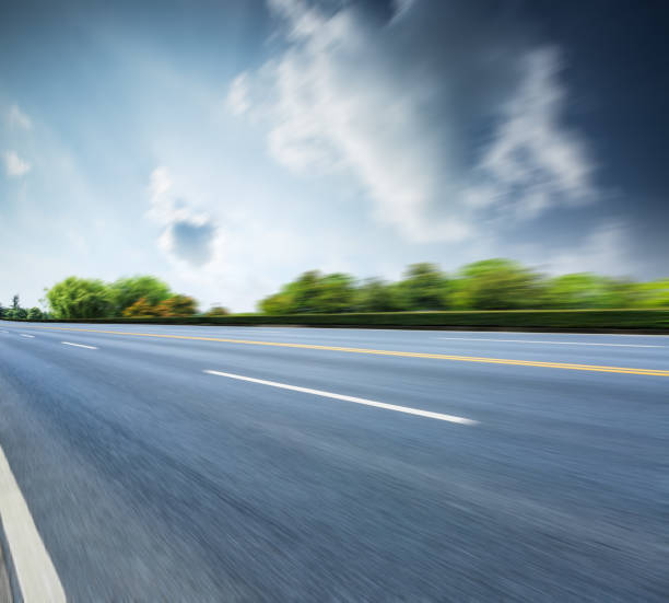 istock Country asphalt road,Motion blurred road background 688515552