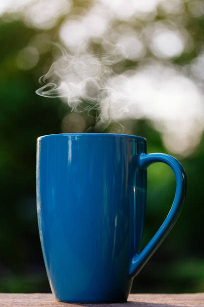 istock A cup of coffee in bokeh background 688526856