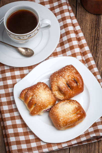 istock Buns with berries on a wooden table. 688552210