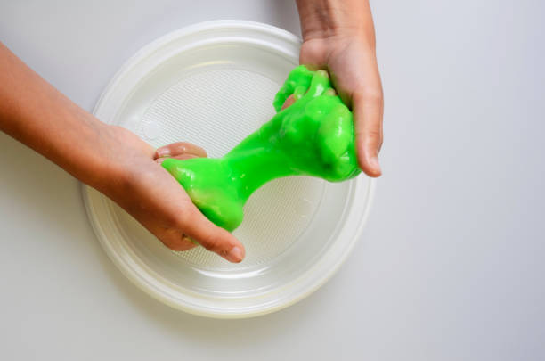 istock Pate slime elastic and viscous on child's hand 688554084