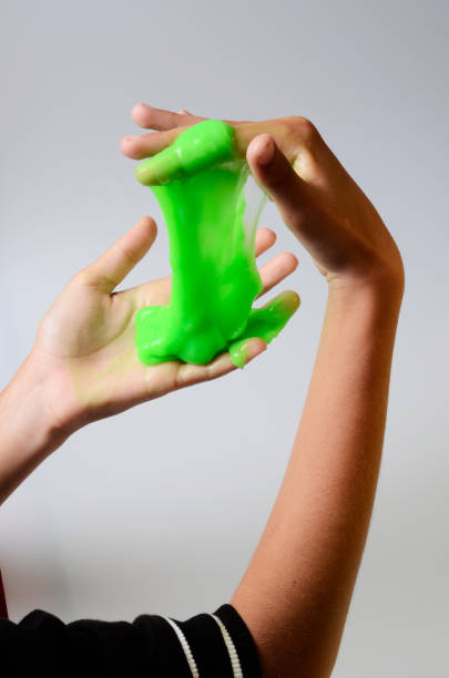 istock Pate slime elastic and viscous on child's hand 688554564