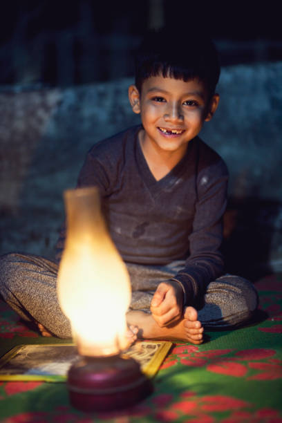 istock Indian boy with oil lamp 688554758