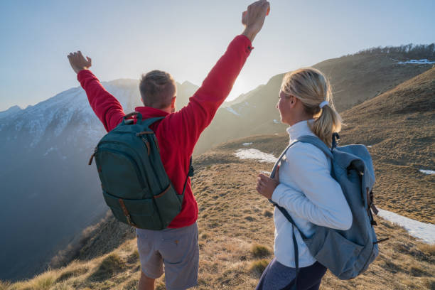 istock Achievement on mountain top, two hikers celebrating 688556556