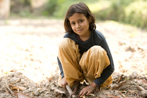 Rural Indian girl with gardening hoe