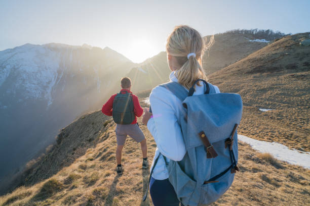 istock Couple hiking in Switzerland, springtime 688559312