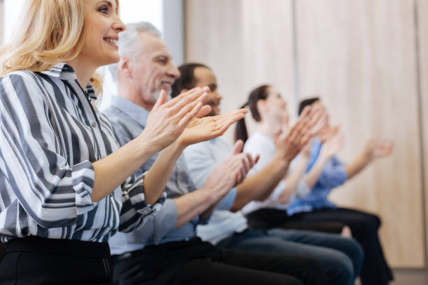 istock Pleasant delighted audience applauding 688564090