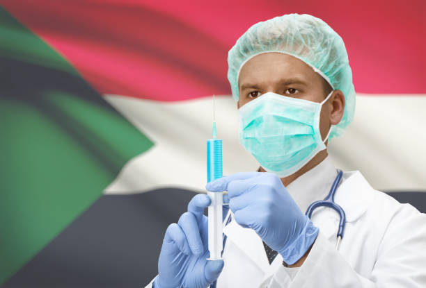 istock Doctor with syringe in hands and flag on background series - Sudan 688568754