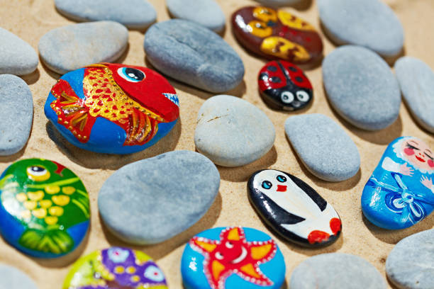 istock Rounded stones from sea vacation painted, souvenir made by kid 688569632
