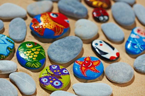 istock Rounded stones from sea vacation painted, souvenir made by kid 688569680