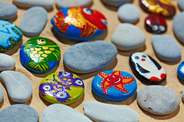 istock Rounded stones from sea vacation painted, souvenir made by kid 688569882
