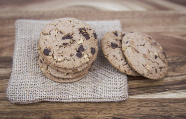 istock Cookies with milk on a wooden floor 688570770